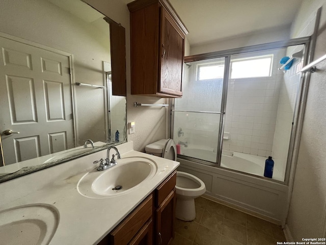 6719 Dragon Fire, San Antonio, TX 78242 - bathroom featuring toilet, double vanity, enclosed tub / shower combo, and tile patterned flooring