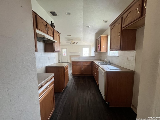 6719 Dragon Fire, San Antonio, TX 78242 - kitchen featuring under cabinet range hood, a sink, backsplash, dark wood-type flooring, and ceiling fan