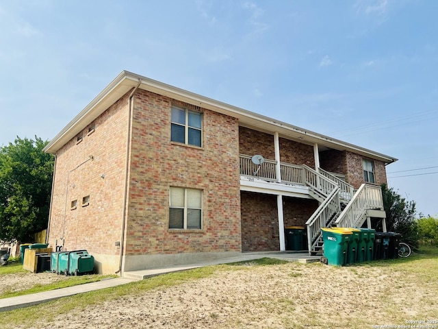 510 Dukeway, Universal City, TX 78148 - back of house featuring brick siding and stairway