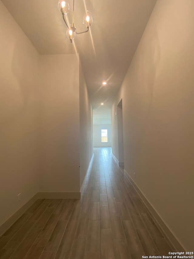 1641 Saddleback Run, New Braunfels, TX 78130 - hall featuring wood finished floors, a chandelier, and baseboards