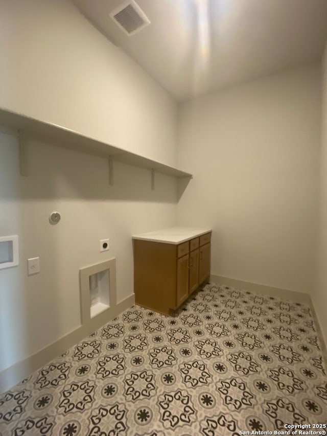1641 Saddleback Run, New Braunfels, TX 78130 - laundry room with hookup for an electric dryer, baseboards, washer hookup, and cabinet space