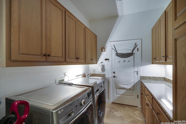 19902 Messina, San Antonio, TX 78258 - washroom featuring washer and clothes dryer and cabinet space