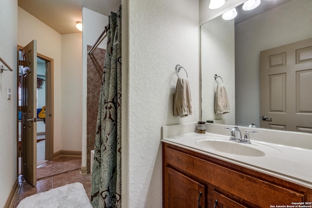 5502 Waldon Walk, San Antonio, TX 78261 - bathroom with vanity, tile patterned flooring, curtained shower, and a textured wall
