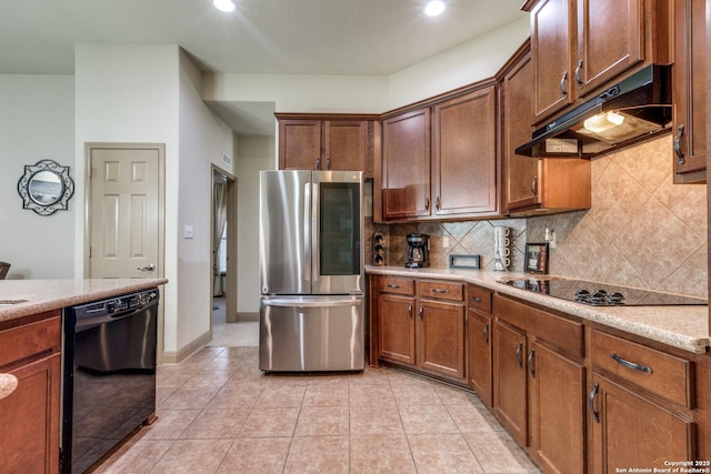 5502 Waldon Walk, San Antonio, TX 78261 - kitchen featuring black appliances, under cabinet range hood, tasteful backsplash, recessed lighting, and light tile patterned floors