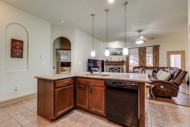 5502 Waldon Walk, San Antonio, TX 78261 - kitchen with black dishwasher, open floor plan, a sink, a ceiling fan, and a tiled fireplace