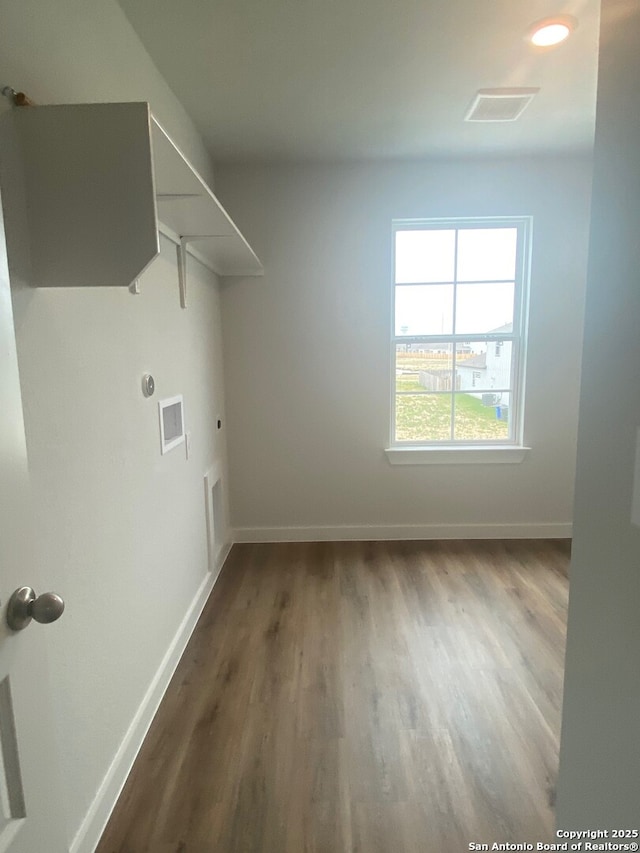 2046 Newforest Peak, New Braunfels, TX 78130 - washroom with wood finished floors, electric dryer hookup, baseboards, and washer hookup