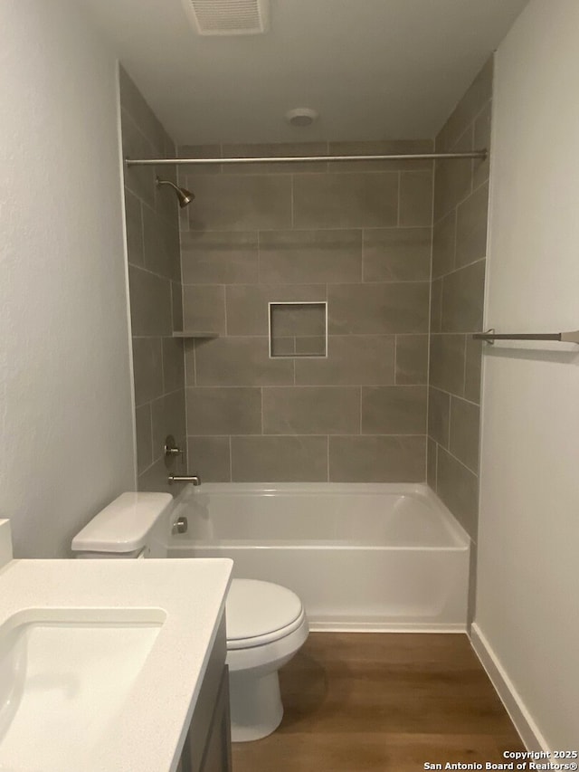 2046 Newforest Peak, New Braunfels, TX 78130 - full bath featuring toilet, wood finished floors, vanity, and tub / shower combination