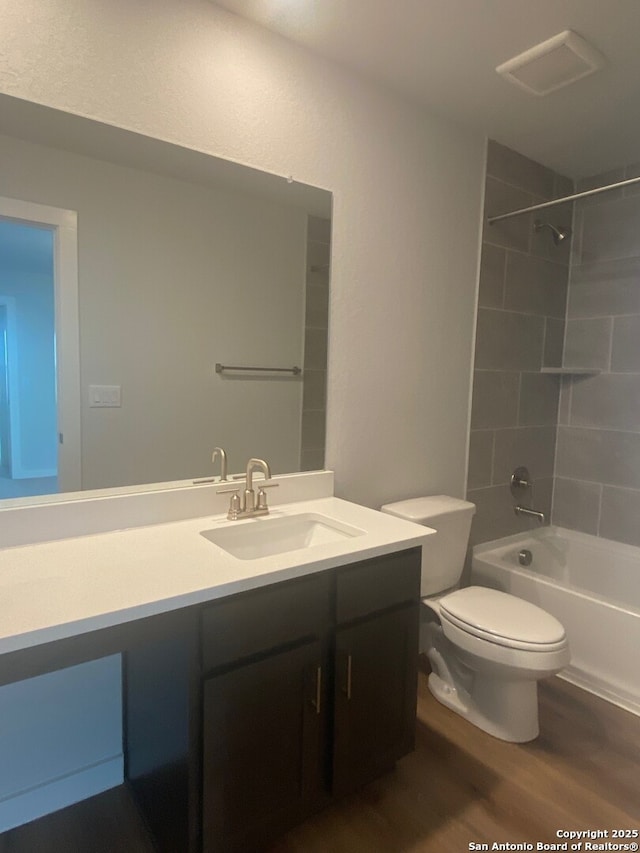 2046 Newforest Peak, New Braunfels, TX 78130 - bathroom with wood finished floors, vanity, toilet, and  shower combination