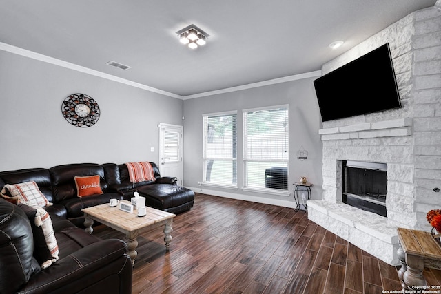 23534 Enchanted Bnd, San Antonio, TX 78260 - living area featuring baseboards, dark wood finished floors, a stone fireplace, and crown molding