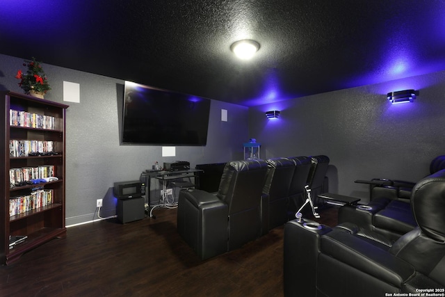 23534 Enchanted Bnd, San Antonio, TX 78260 - cinema with a textured wall, wood finished floors, a textured ceiling, and baseboards
