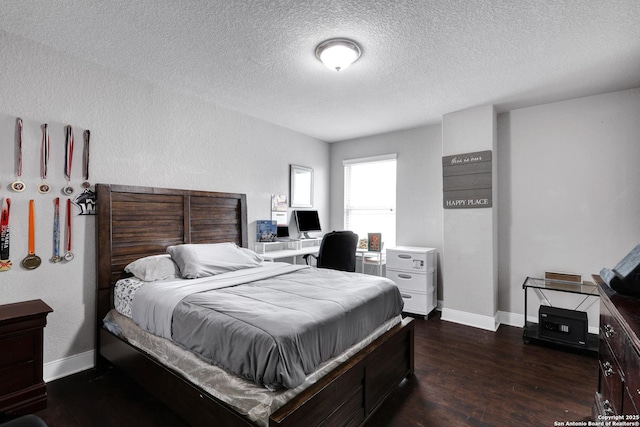 23534 Enchanted Bnd, San Antonio, TX 78260 - bedroom with a textured ceiling, dark wood-style floors, and baseboards