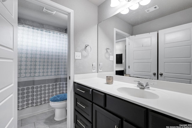 23534 Enchanted Bnd, San Antonio, TX 78260 - full bathroom featuring tile patterned flooring, vanity, curtained shower, toilet, and a textured wall