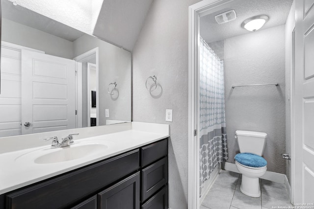 23534 Enchanted Bnd, San Antonio, TX 78260 - bathroom with toilet, a textured wall, tile patterned floors, vanity, and a shower with curtain