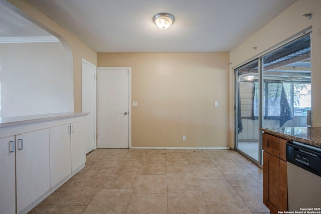 12231 El Santo Way, San Antonio, TX 78233 - unfurnished dining area with arched walkways and baseboards