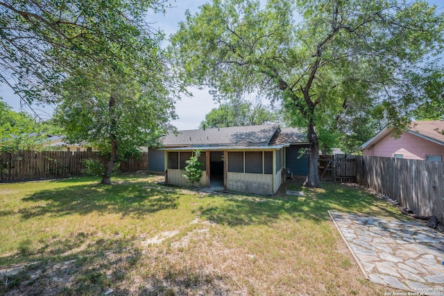 12231 El Santo Way, San Antonio, TX 78233 - rear view of property with a sunroom
