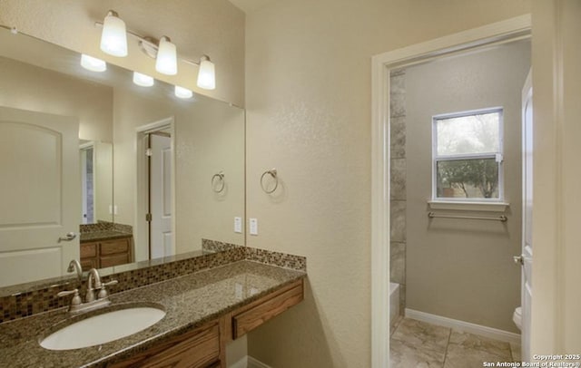 121 E Ashton, Floresville, TX 78114 - full bath featuring vanity, toilet, and baseboards