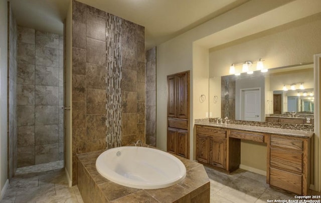 121 E Ashton, Floresville, TX 78114 - full bathroom featuring a bath, vanity, baseboards, and a tile shower