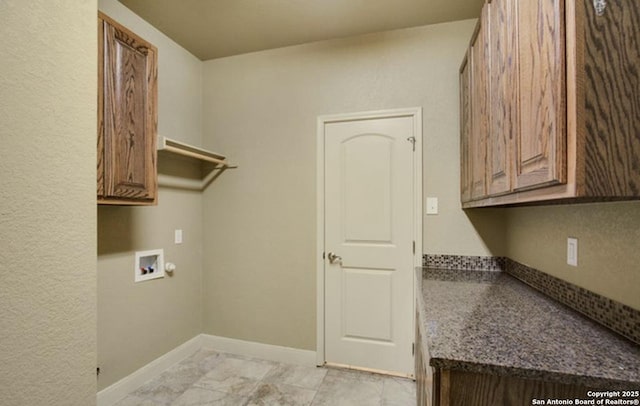 121 E Ashton, Floresville, TX 78114 - washroom featuring cabinet space, washer hookup, and baseboards