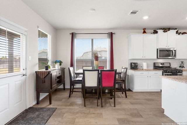 104 Mossy Bank, Cibolo, TX 78108 - dining room featuring light wood-style floors, recessed lighting, and baseboards