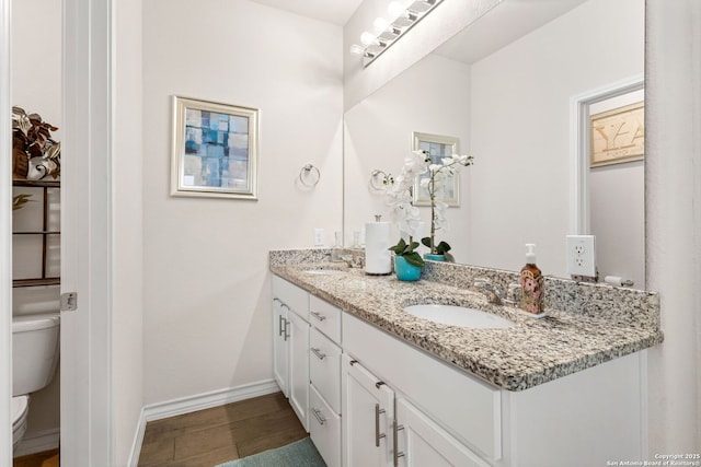 104 Mossy Bank, Cibolo, TX 78108 - bathroom with toilet, double vanity, and baseboards