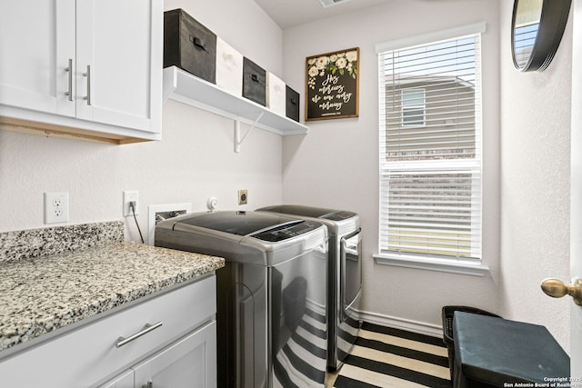 104 Mossy Bank, Cibolo, TX 78108 - clothes washing area with washing machine and clothes dryer, healthy amount of natural light, baseboards, and cabinet space