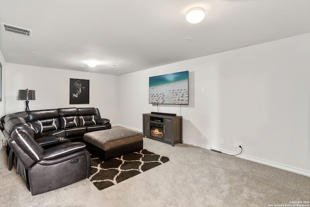 104 Mossy Bank, Cibolo, TX 78108 - living area featuring carpet flooring, a glass covered fireplace, and baseboards