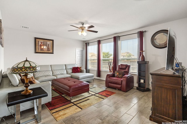 104 Mossy Bank, Cibolo, TX 78108 - living room with ceiling fan, light wood finished floors, and baseboards