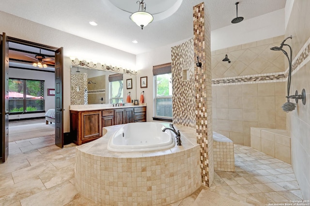 bathroom with a garden tub, a walk in shower, vanity, and ensuite bathroom