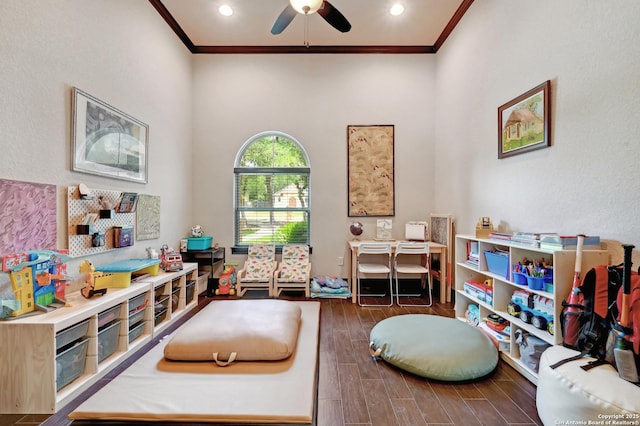 recreation room with ornamental molding, ceiling fan, wood finished floors, and recessed lighting