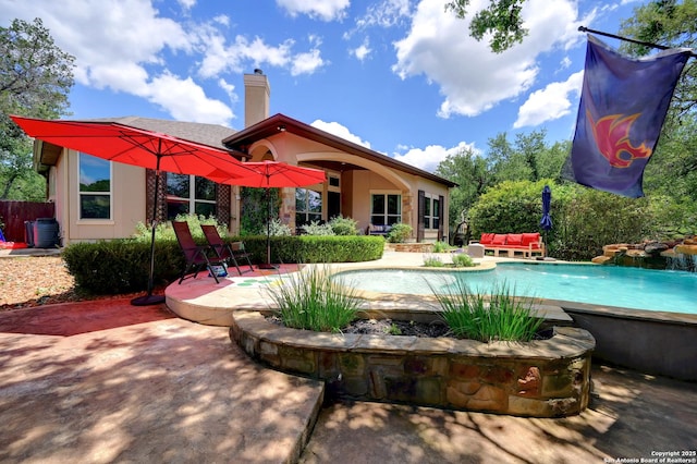 outdoor pool featuring a patio area and outdoor lounge area