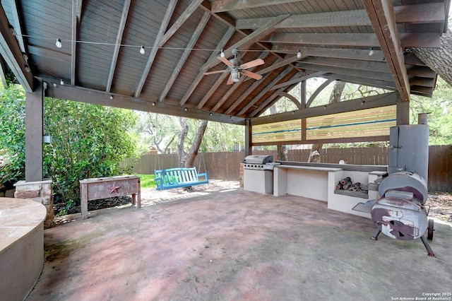 view of patio / terrace featuring exterior kitchen, a gazebo, a fenced backyard, a ceiling fan, and area for grilling