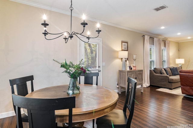 9668 Nueces Cyn, San Antonio, TX 78251 - dining area featuring a chandelier, dark wood finished floors, crown molding, recessed lighting, and baseboards