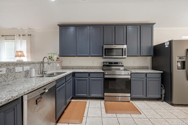 140 Eagle Vail, San Antonio, TX 78258 - kitchen featuring stainless steel appliances, a sink, ornamental molding, light tile patterned floors, and light stone counters