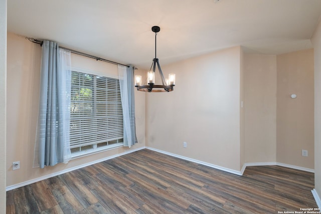 9911 Mustang Isle, San Antonio, TX 78254 - spare room featuring a chandelier, dark wood finished floors, and baseboards