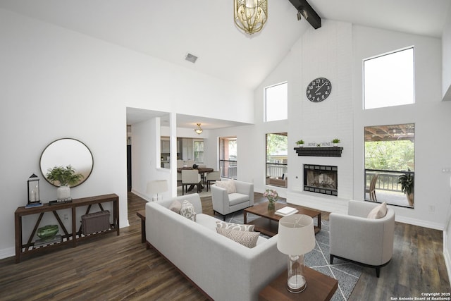 8318 Tiguex, Universal City, TX 78148 - living room featuring beam ceiling, wood finished floors, high vaulted ceiling, a fireplace, and healthy amount of natural light