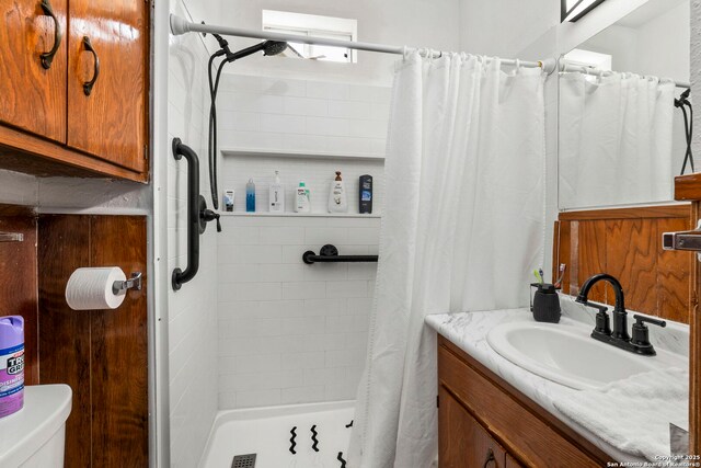 942 Mcilvaine, San Antonio, TX 78201 - full bathroom featuring vanity, a shower stall, and toilet