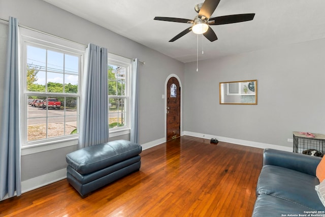 942 Mcilvaine, San Antonio, TX 78201 - living area with arched walkways, wood-type flooring, baseboards, and a ceiling fan
