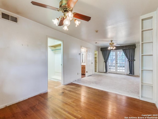 355 Donella, Hollywood Park, TX 78232 - unfurnished living room featuring a ceiling fan, wood-type flooring, french doors, and baseboards