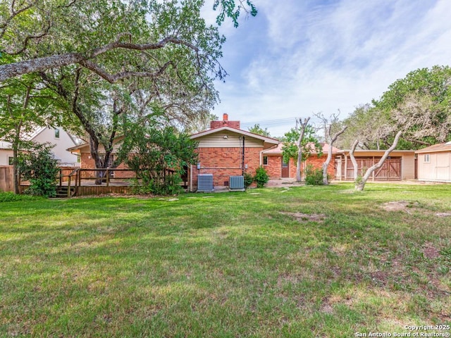 355 Donella, Hollywood Park, TX 78232 - view of green lawn featuring cooling unit, a wooden deck, and a storage shed