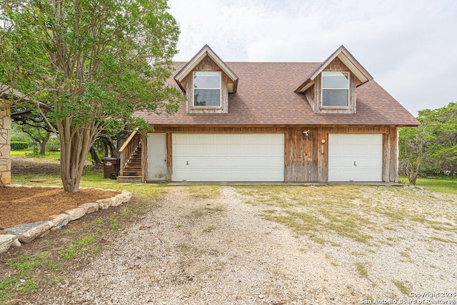 1 Carolyn Ln, Boerne, TX 78006 - view of front of house with a garage, stairway, and roof with shingles