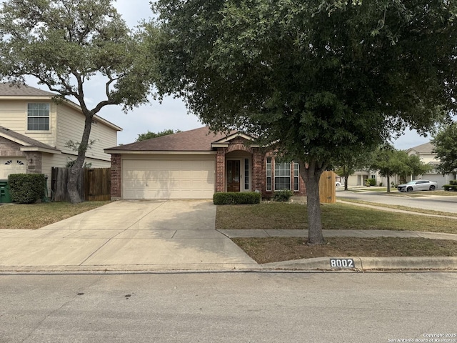 8002 Wever Xing, San Antonio, TX 78250 - view of front of house featuring a garage, brick siding, and concrete driveway