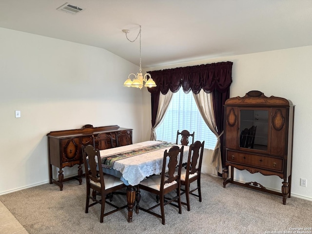 8002 Wever Xing, San Antonio, TX 78250 - dining space featuring a chandelier, vaulted ceiling, light colored carpet, and baseboards