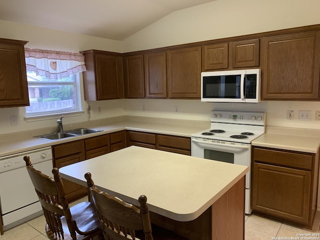 8002 Wever Xing, San Antonio, TX 78250 - kitchen with white appliances, a sink, light tile patterned flooring, lofted ceiling, and light countertops