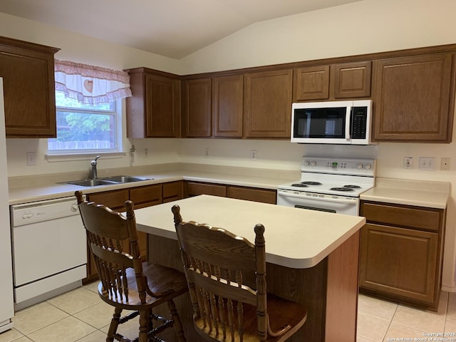 8002 Wever Xing, San Antonio, TX 78250 - kitchen with white appliances, a sink, light tile patterned floors, lofted ceiling, and light countertops