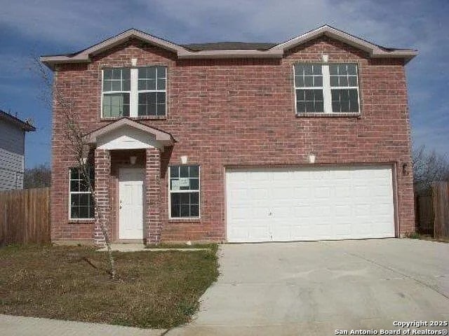 8619 Key N, Converse, TX 78109 - view of front of property featuring an attached garage, driveway, and brick siding