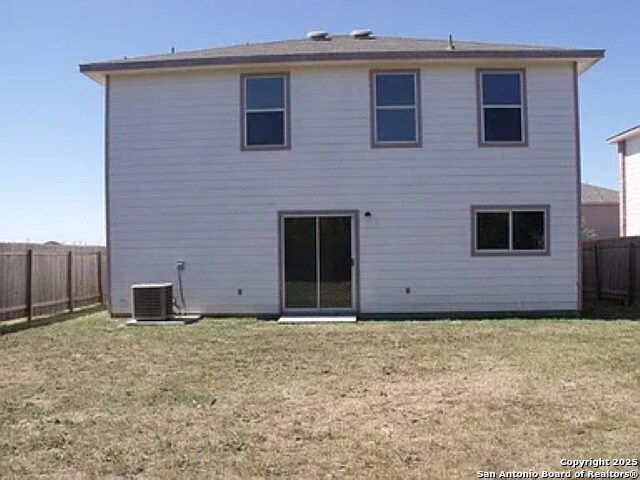 8619 Key N, Converse, TX 78109 - back of property featuring central air condition unit
