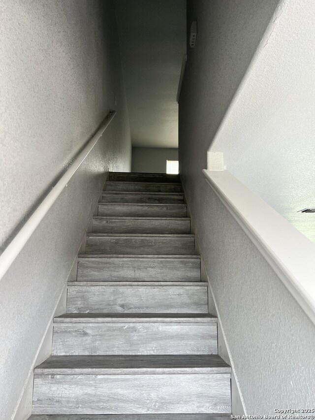 8619 Key N, Converse, TX 78109 - stairs featuring a textured wall