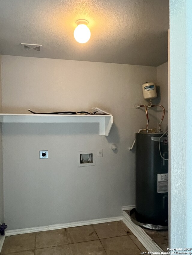 8619 Key N, Converse, TX 78109 - laundry room featuring water heater, electric dryer hookup, washer hookup, a textured ceiling, and tile patterned flooring