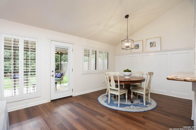 2834 Burning Log, San Antonio, TX 78247 - dining area featuring dark wood-style floors, a chandelier, lofted ceiling, a decorative wall, and wainscoting