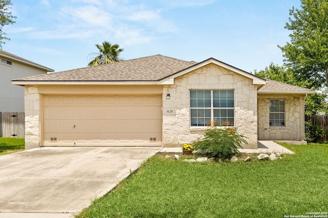 3628 Tilden, New Braunfels, TX 78132 - ranch-style house featuring stone siding, roof with shingles, concrete driveway, and a garage